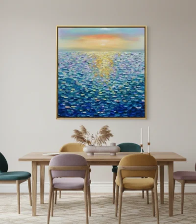 Textured impressionist seascape hand-painted canvas with golden sunrise reflection and layered blue-green water, contemporary dining space