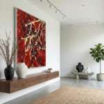 Gestural abstract expressionist hand-painted canvas in bold red, cream, and navy brushstrokes, modern living space
