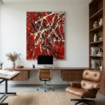 Gestural abstract expressionist hand-painted canvas in bold red, cream and black dripped brushstrokes, modern office setting
