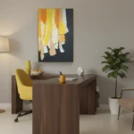 Contemporary abstract hand-painted canvas depicting cascading yellow and orange forms with white accents on dark background, modern office space
