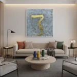 Gestural abstract hand-painted canvas with flowing golden brushstrokes on textured grey background, contemporary living space