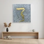 Minimalist hand-painted canvas featuring a sinuous gold brushstroke on textured grey background, contemporary living space