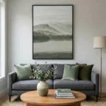 Minimalist landscape hand-painted canvas depicting misty mountains and still water in soft greens and grays, contemporary living space