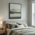 Tonal landscape hand-painted canvas depicting misty mountains and serene lake in muted greens and grays, contemporary bedroom