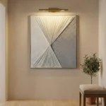 Textured abstract hand-painted canvas with radiating linear patterns converging at center in monochrome grays and whites, contemporary interior