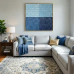 Minimalist abstract hand-painted canvas with layered horizontal stripes in light blue and deep navy tones, contemporary living space