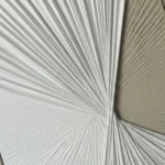 Textured abstract hand-painted canvas with radiating linear brushstrokes in cream and soft grey tones, contemporary interior