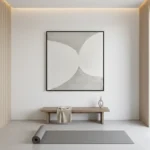 Minimalist hand-painted canvas with organic curved forms in soft greys and whites, yoga studio setting