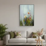 Impressionist hand-painted canvas depicting wildflowers in warm yellows and pinks against misty grey-green foliage, contemporary living space