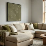 Minimalist hand-painted canvas depicting a flock of birds in flight, rendered in soft sage and cream tones, contemporary living space