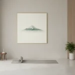 Minimalist hand-painted canvas depicting a snow-capped mountain peak in muted grey and cream tones, yoga studio setting