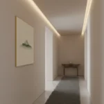 Minimalist landscape hand-painted canvas depicting misty mountain peak in muted greens and grays, contemporary hallway