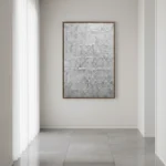 Textured abstract hand-painted canvas in monochrome grey tones with gestural brushwork, contemporary gallery space