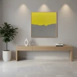 Minimalist hand-painted canvas with bold yellow upper half and muted grey lower section divided by organic wavy line, contemporary living space