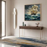 Impressionist seascape painting depicting a sailing ship navigating stormy ocean waves in golden and teal tones, contemporary entryway