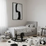 Minimalist monochrome hand-painted canvas depicting abstract silhouette form in black ink, contemporary children's room