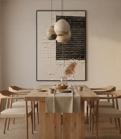 Contemporary abstract wall art with layered geometric forms, spherical shapes, and textured grid patterns in cream and charcoal tones, dining space