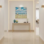 Impressionist hand-painted canvas depicting sun-drenched beach scene with sailboats, figures, and luminous blue sky in warm sandy tones, contemporary entryway