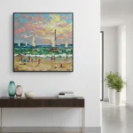 Impressionist hand-painted canvas depicting beachgoers and sailboats beneath a dramatic sunset sky in warm and cool tones, contemporary entryway