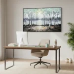 Impressionist landscape painting depicting birch trees framing a serene water view in soft blues and creams, modern workspace