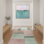 Minimalist landscape hand-painted canvas in soft pastels and muted greens with layered horizon, contemporary hallway