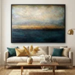 Layered abstract seascape hand-painted canvas in deep teals, golden ochres, and clouded whites, contemporary living space