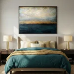 Layered abstract landscape hand-painted canvas in teal, gold and cream tones, contemporary bedroom setting
