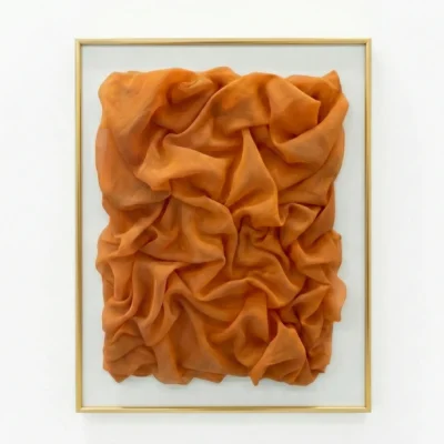 Textured abstract hand-painted canvas in rich burnt orange with sculptural fabric folds and dimensional layering