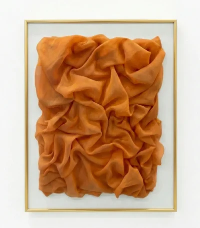 Textured abstract hand-painted canvas in rich burnt orange with sculptural fabric folds and dimensional layering