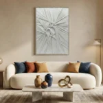 Textured abstract hand-painted canvas with radiating linear patterns in soft monochrome tones, contemporary living space