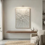 Textured abstract hand-painted canvas with radiating linear patterns in monochrome white and grey, modern living space