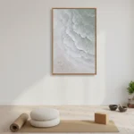 Minimalist abstract hand-painted canvas depicting layered ocean waves in soft whites and pale greens, styled in a zen meditation space