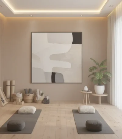 Minimalist abstract hand-painted canvas in cream, grey and black organic shapes, yoga studio setting