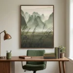 Impressionist landscape hand-painted canvas depicting misty mountains and coastal grasses in soft green and gray tones, contemporary workspace