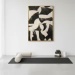 Gestural abstract hand-painted canvas in bold black and cream organic shapes, modern minimalist space
