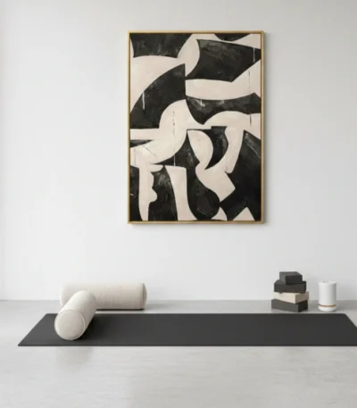 Gestural abstract hand-painted canvas in bold black and cream organic shapes, modern minimalist space