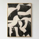 Gestural abstract hand-painted canvas in bold black and cream organic shapes with expressive brushwork, contemporary space