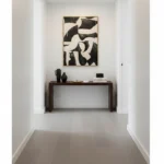 Contemporary abstract hand-painted canvas with bold black and white geometric forms, hallway accent