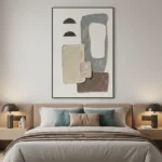 Minimalist hand-painted canvas with abstract geometric shapes in cream, charcoal, and taupe tones, modern bedroom