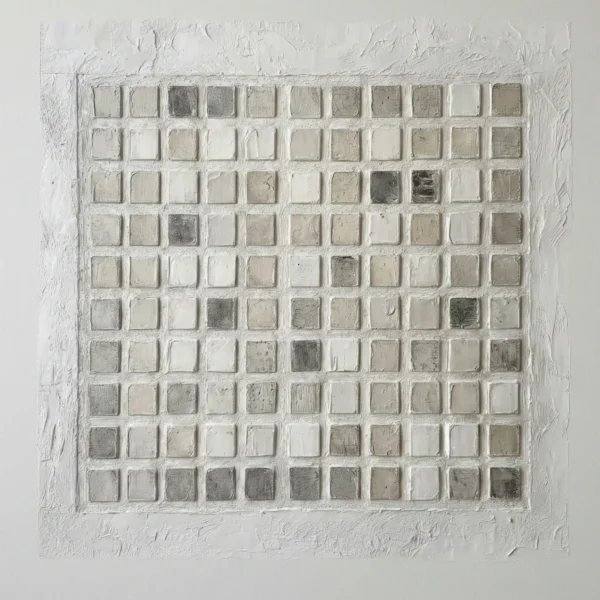 Textured minimalist wall art featuring a grid of hand-painted cream and taupe squares with subtle tonal variations, contemporary living space
