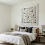 Textured abstract hand-painted canvas in cream and grey tones with geometric grid pattern, modern bedroom