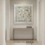 Minimalist hand-painted canvas with grid of cream and taupe squares in textured relief, contemporary entryway