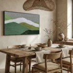 Minimalist landscape hand-painted canvas with layered green hills and white ribbon river, cool tones, dining space