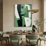 Contemporary abstract hand-painted canvas in green, black, and white with gestural brushstrokes, modern dining space