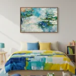 Layered abstract expressionist hand-painted canvas in blues, yellows, and teals with gestural brushstrokes, contemporary bedroom setting