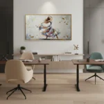Gestural figurative hand-painted canvas depicting a twirling dancer in vibrant blue and ochre tones with dynamic brushwork, contemporary office space