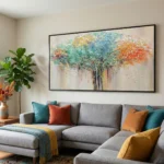 Textured abstract landscape hand-painted canvas depicting a vibrant tree in turquoise, orange, and gold tones, contemporary living space