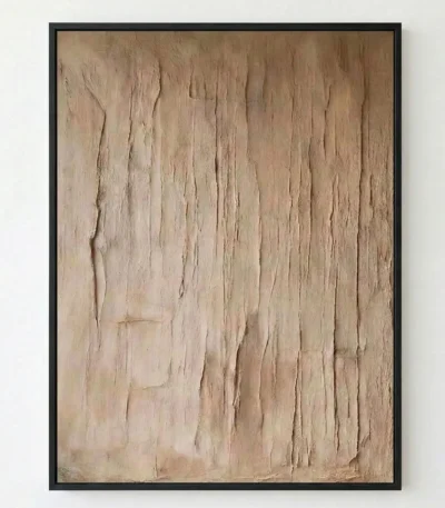 Textured abstract hand-painted canvas in warm taupe and cream tones with vertical gestural marks, contemporary living space