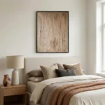 Textured abstract hand-painted canvas in warm beige and taupe tones with gestural brushwork, modern bedroom setting