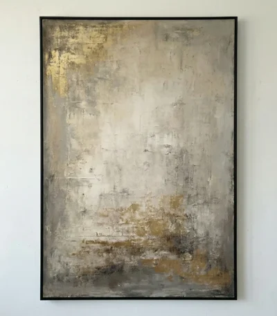 Textured abstract hand-painted canvas in layered cream, gold, and charcoal tones with gestural brushwork, contemporary living space